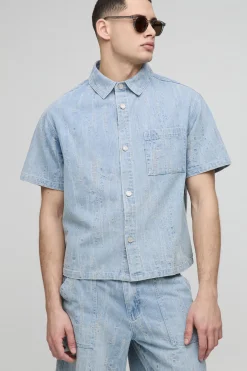 Chemise en denim distressed à col boxy