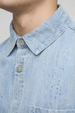 Chemise en denim distressed à col boxy