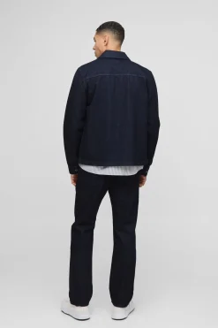 Chemise en denim indigo élégante à manches longues, coupe régulière.
