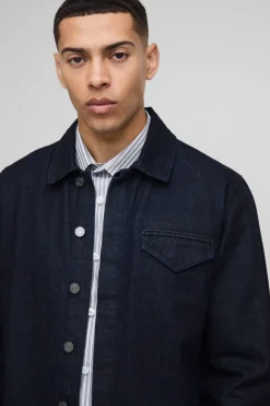Chemise en denim indigo élégante à manches longues, coupe régulière.