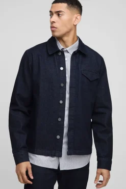 Chemise en denim indigo élégante à manches longues, coupe régulière.