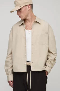 boohooMAN Chemise en popeline à manches longues, brodée, au style carré et surdimensionnée avec un ourlet bungee<Homme Chemises