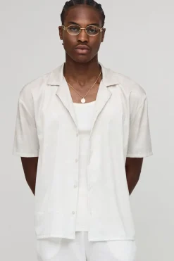Chemise en satin oversize à imprimé monogramme