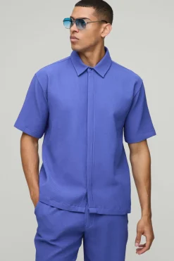 Chemise à manches courtes oversize avec plastron dissimulé et plis