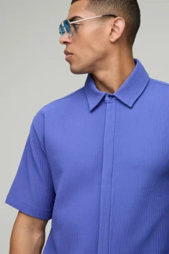 Chemise à manches courtes oversize avec plastron dissimulé et plis