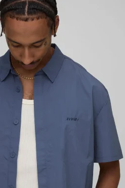 Chemise à manches courtes surdimensionnée à patte de boutonnage dissimulée et effet froissé