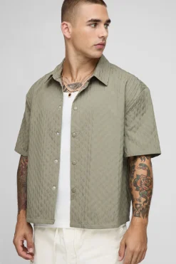 Chemise à manches courtes surdimensionnée avec plis décoratifs et ourlet incurvé