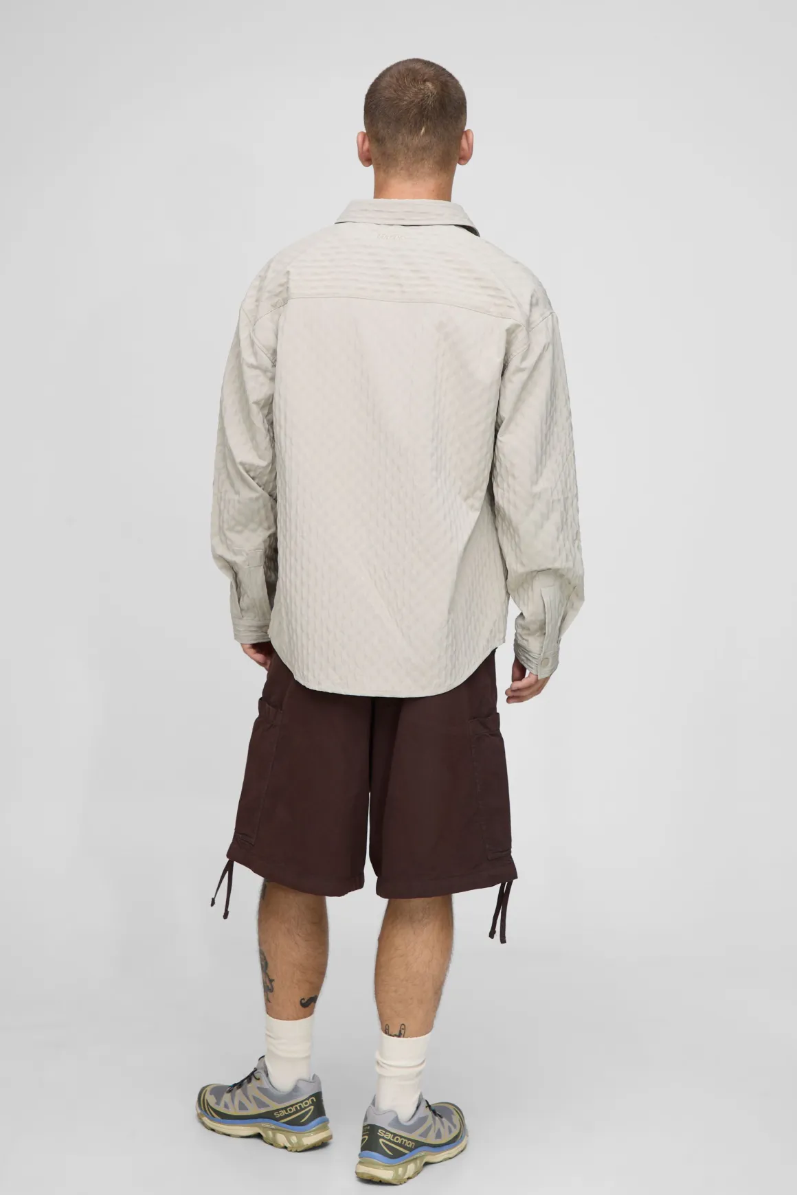 Chemise à manches longues oversize à pinces et ourlet incurvé