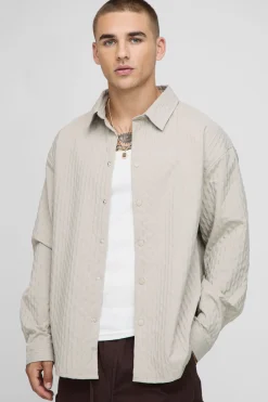 Chemise à manches longues oversize à pinces et ourlet incurvé