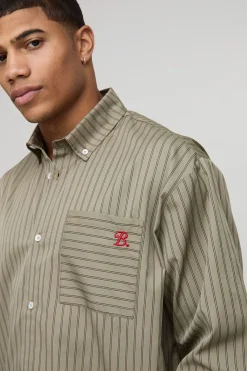 Chemise oversize à manches longues à rayures et ourlet incurvé