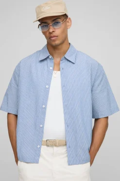 Chemise oversize à manches mi-longues à col rayé