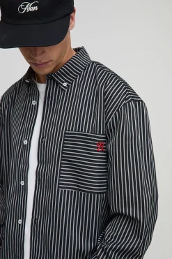 Chemise oversize, style boxy à rayures, manches longues et ourlet incurvé