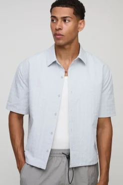 Chemise surdimensionnée, coupe boxy, à carreaux techniques et ourlet élastique Bungee