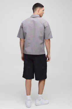Chemise surdimensionnée en nylon froissé à fermeture éclair, manches courtes