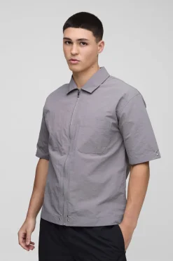 Chemise surdimensionnée en nylon froissé à fermeture éclair, manches courtes