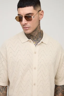 Chemise tricotée longue à manches courtes, coupe boxy, à points de couture ouverts