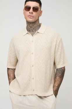 Chemise tricotée longue à manches courtes, coupe boxy, à points de couture ouverts