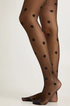 Collants transparents à gros pois