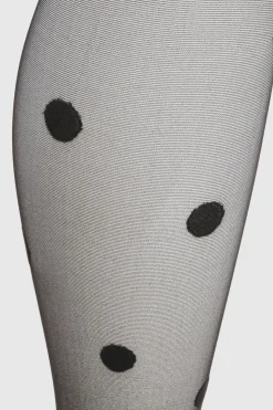 Collants transparents à gros pois