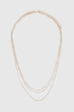 Collier superposé délicat à boules et chaînes