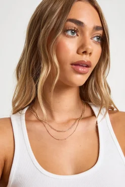 Collier superposé délicat à boules et chaînes