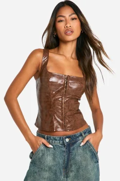 Corset en synthétique effet crocodile à crochets et œillets
