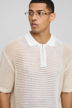 Coupe boxy, blocs de couleur, point ouvert, col zippé, polo tricoté