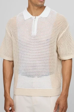 Coupe boxy, blocs de couleur, point ouvert, col zippé, polo tricoté