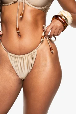 Culotte à nouer sur le côté avec breloque de perle