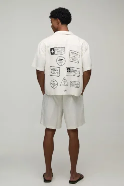 Ensemble Chemise Et Short Coupe Regular En Mélange De Lin À Motif Tampons De Voyage