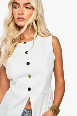 Gilet ajusté à boutons dorés