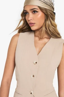 Gilet ajusté à l'aspect lin boutonné