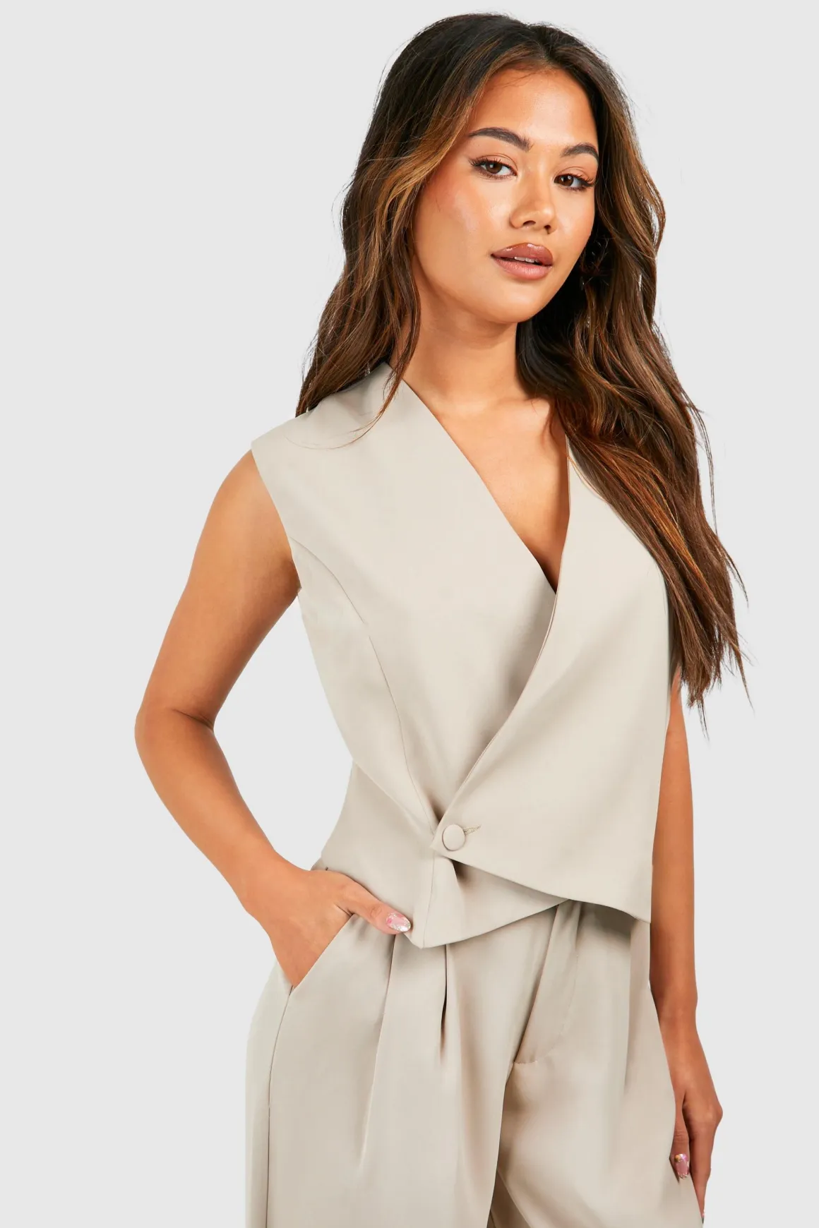 Gilet asymétrique boutonné à l'avant