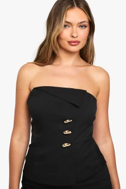 Gilet cintré bandeau à quincaillerie dorée