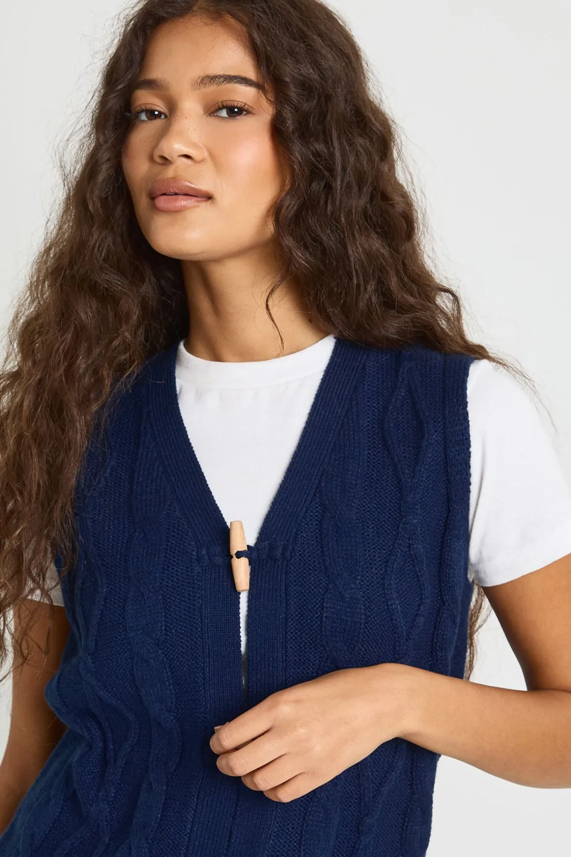 Gilet en maille torsadée à boutons à bascule