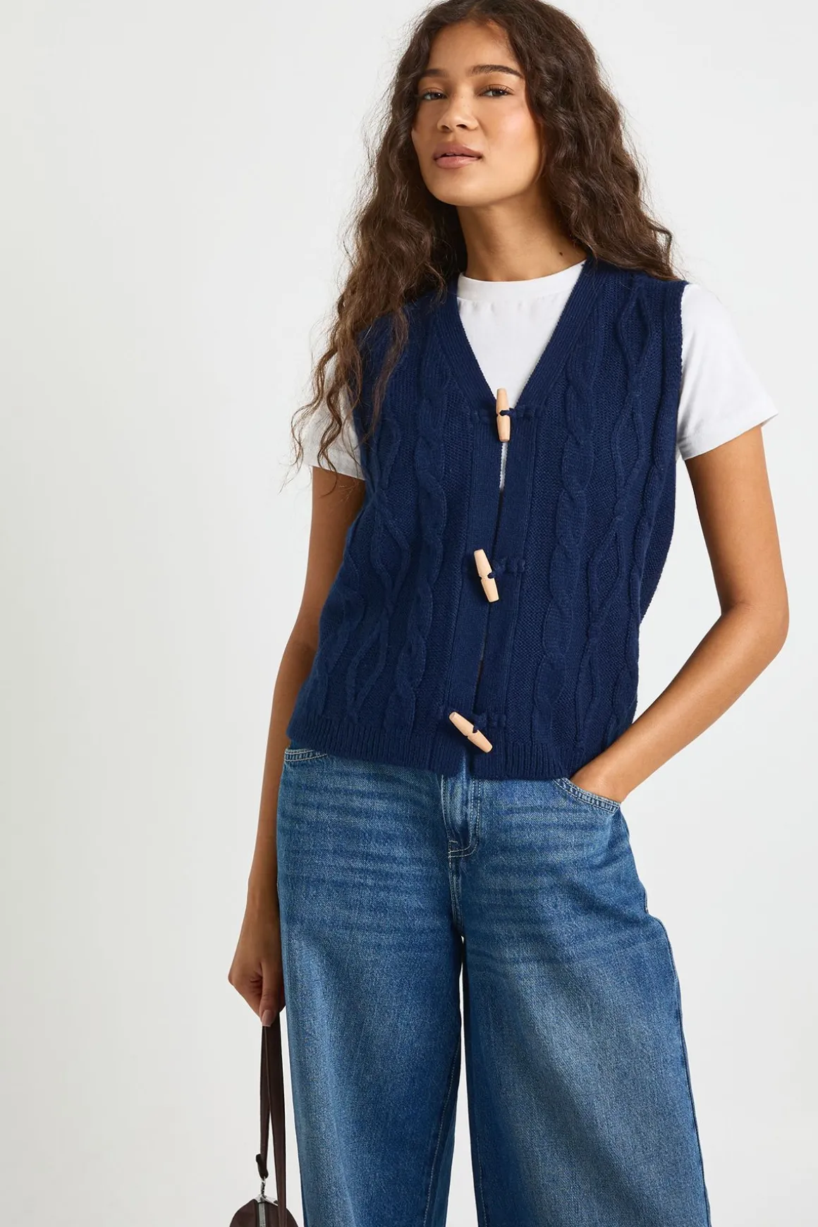 Gilet en maille torsadée à boutons à bascule
