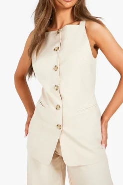 Gilet long texturé à l'aspect de corne imité et boutonné sur le devant