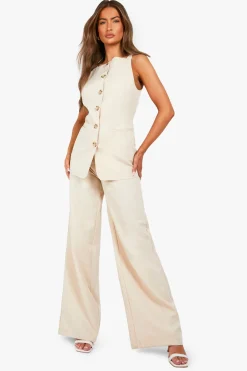 Gilet long texturé à l'aspect de corne imité et boutonné sur le devant