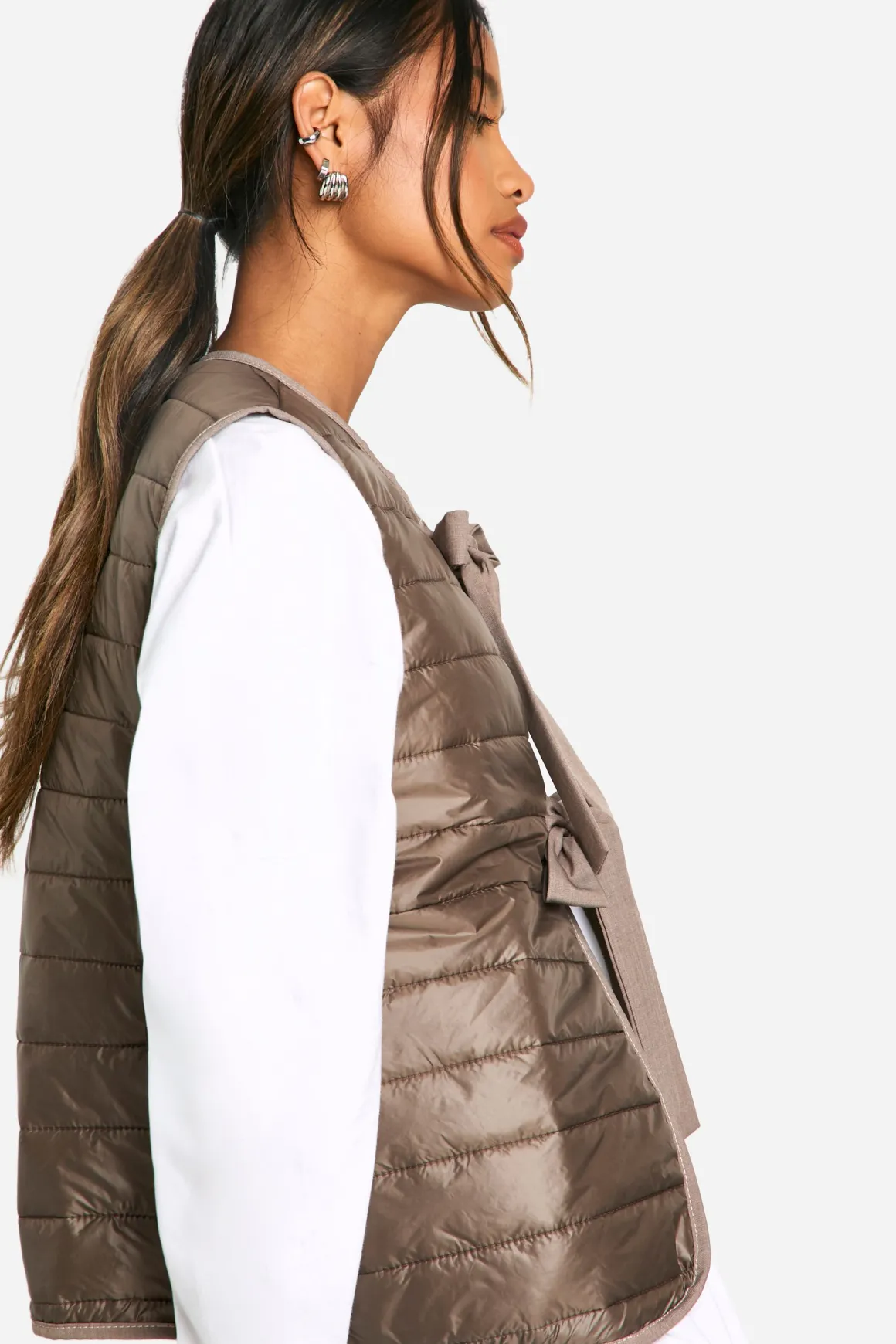 Gilet rembourré orné d'un nœud