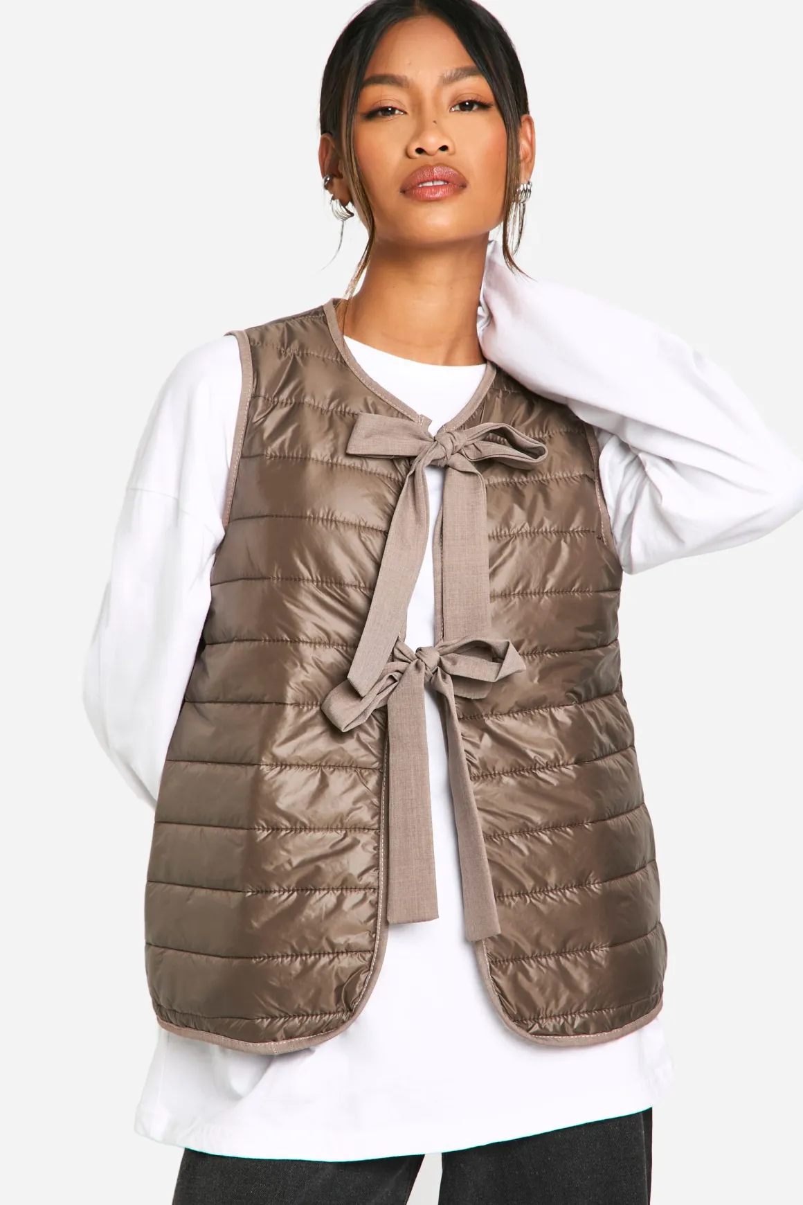 Gilet rembourré orné d'un nœud