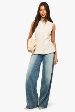 Gilet sans manches cintré à la taille avec boutons dorés texturés