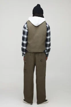 Gilet utilitaire en denim matelassé cargo surteinté, coupe boxy