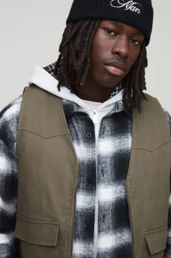 Gilet utilitaire en denim matelassé cargo surteinté, coupe boxy