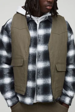 Gilet utilitaire en denim matelassé cargo surteinté, coupe boxy