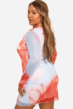 Grande taille - Robe courte fleurie en mesh à manches longues