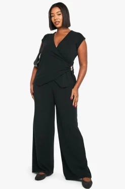 Haut drapé à manches cap orné d'une bordure dorée et pantalon à jambes larges