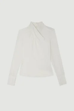 Haut à encolure haute en mélange jersey et georgette