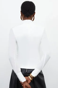 Haut à encolure haute en mélange jersey et georgette