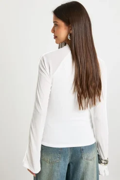 Haut à manches longues en mesh texturé à double couche, détail de couture apparente