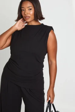Haut à épaulettes avec détails plissés et ourlet asymétrique et pantalon à jambes larges